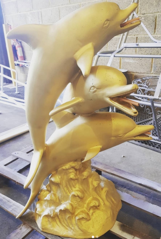 Fiberglass dolphin sculpture