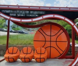 The sphere seat is decorated with fiberglass sculptures basketball style
